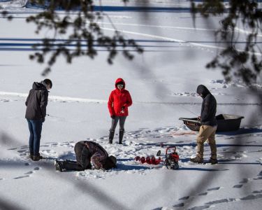 people ice fishing