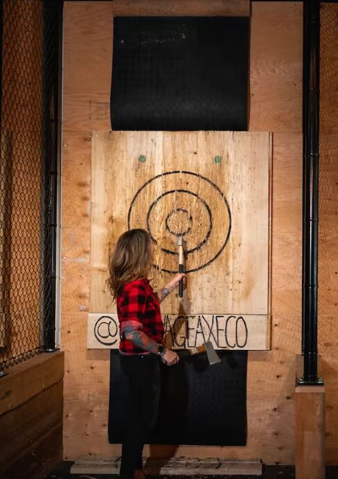 woman axe throwing