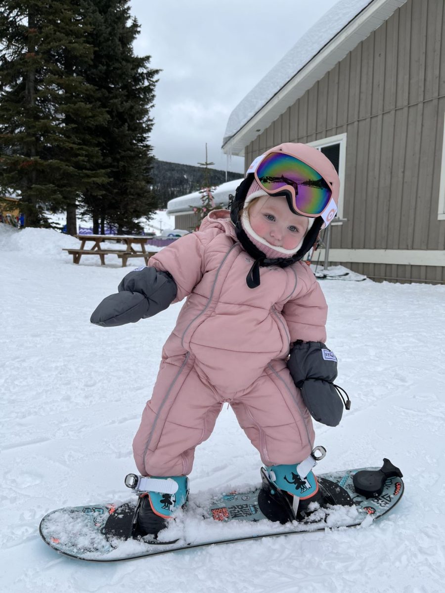 child snowboarding