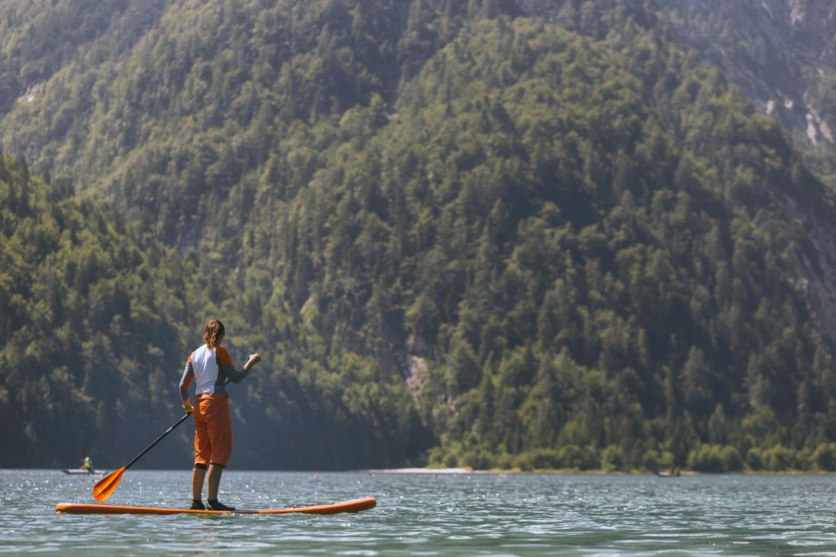 paddle boarding on mountain lake