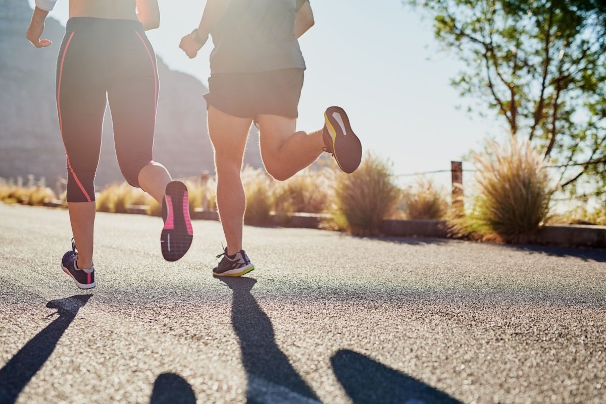 people running on mountain trail
